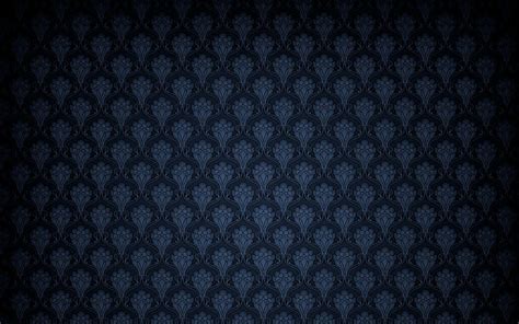 dark blue patterned wallpaper.